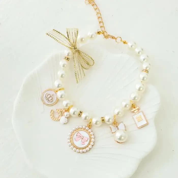 Collier de perles avec nœud pour animaux de compagnie